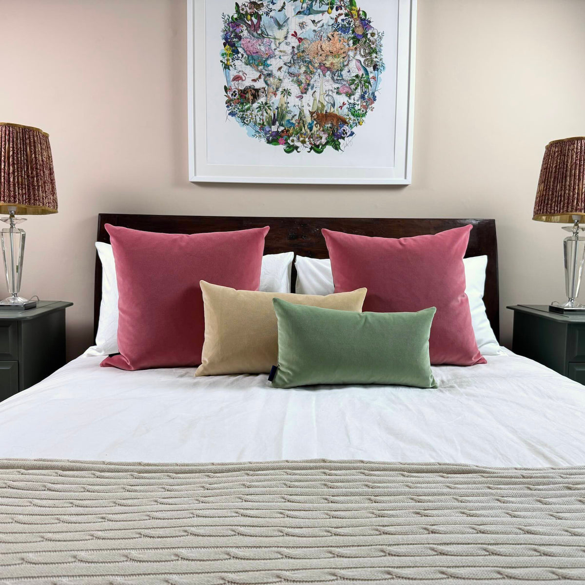 sage green velvet cushion with rose and champagne on wooden bed