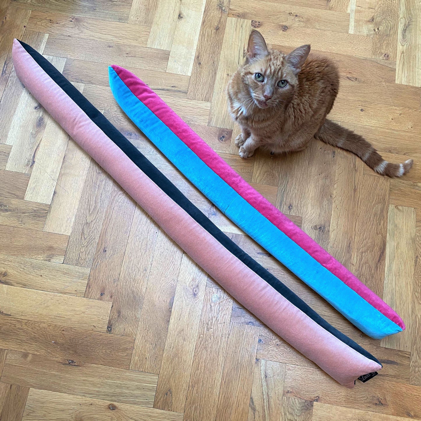 Draft excluder with blush pink velvet front and slate grey velvet reverse