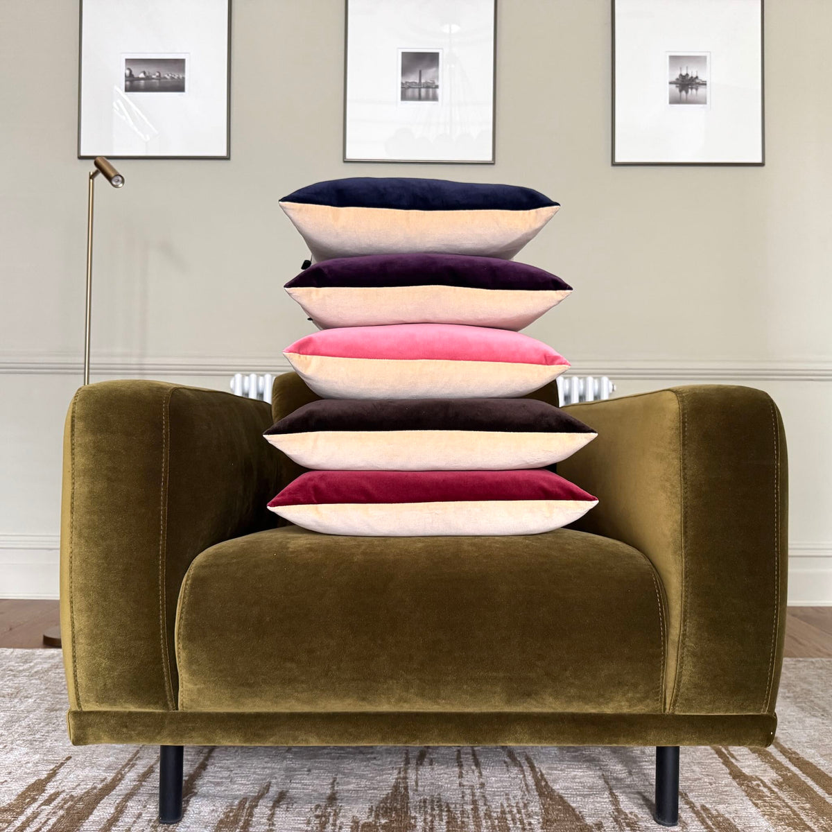 burgundy and champagne velvet cushions piled on olive green chair