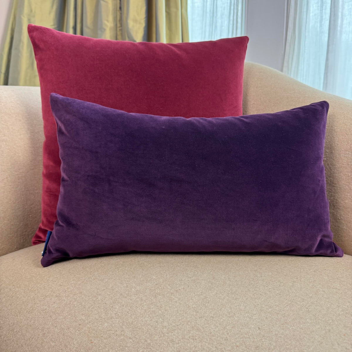 burgundy and plum reversible velvet cushions on beige sofa