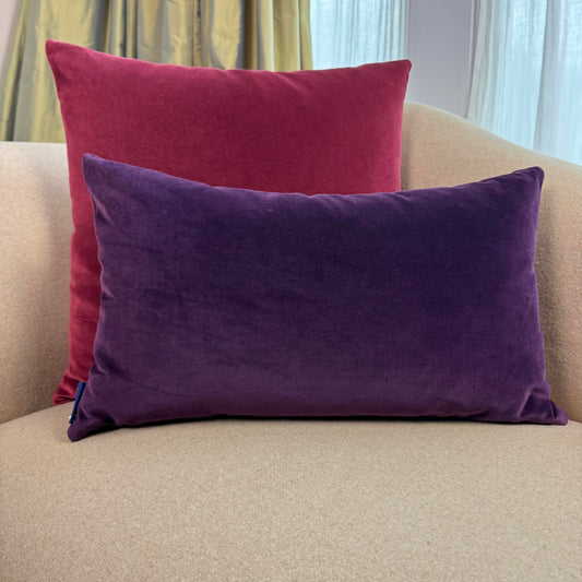 burgundy and plum reversible velvet cushions on beige sofa
