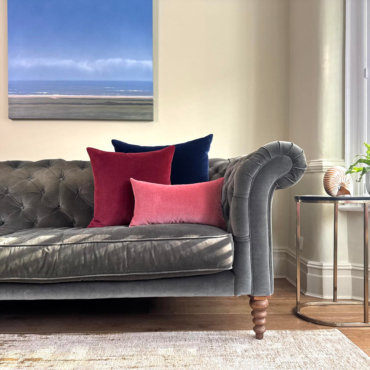 burgundy velvet cushion cover on grey sofa