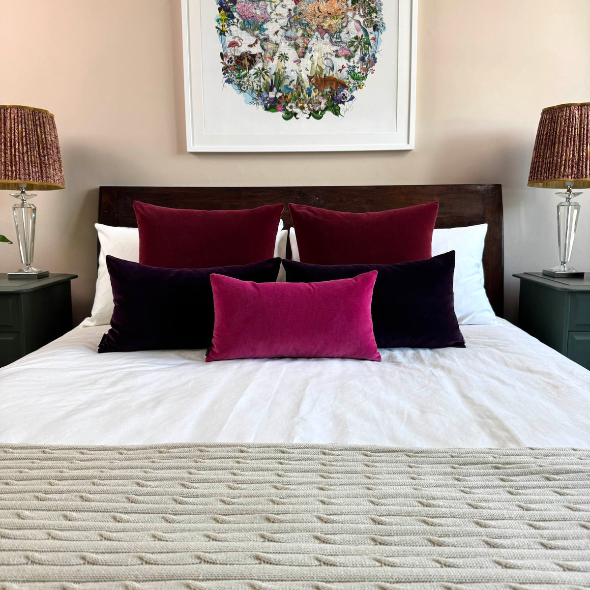 burgundy velvet cushion cover squares with other berry toned cushions on white bedding
