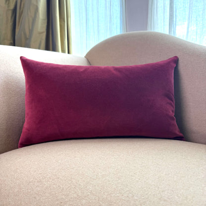 burgundy velvet rectangle cushion on beige sofa