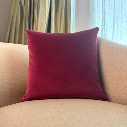 burgundy velvet cushion square on sofa