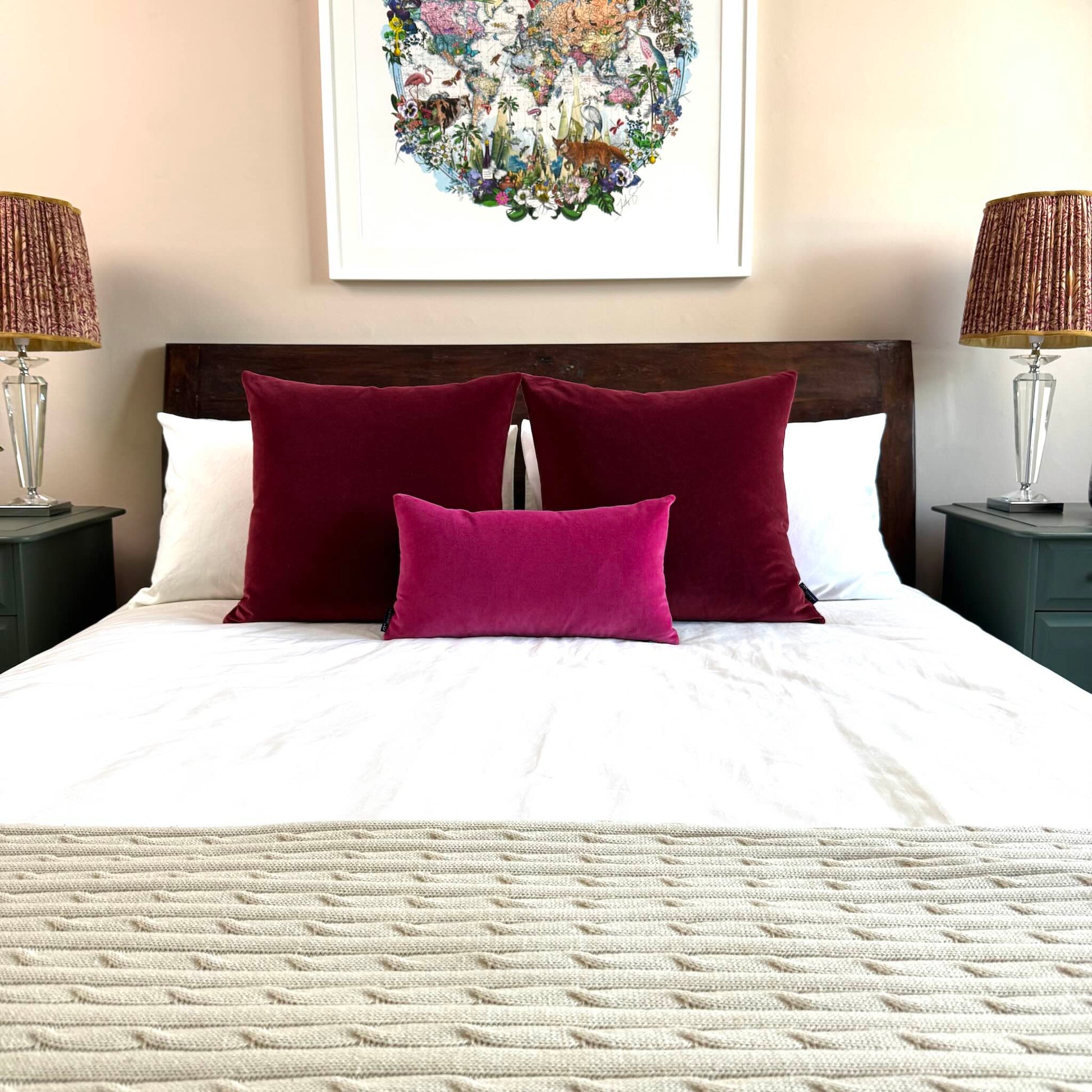 burgundy velvet cushions with fuscia velvet cushion styled on wooden bed
