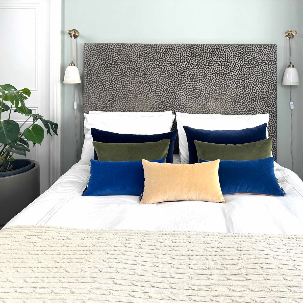 champagne velvet cushion in blue room