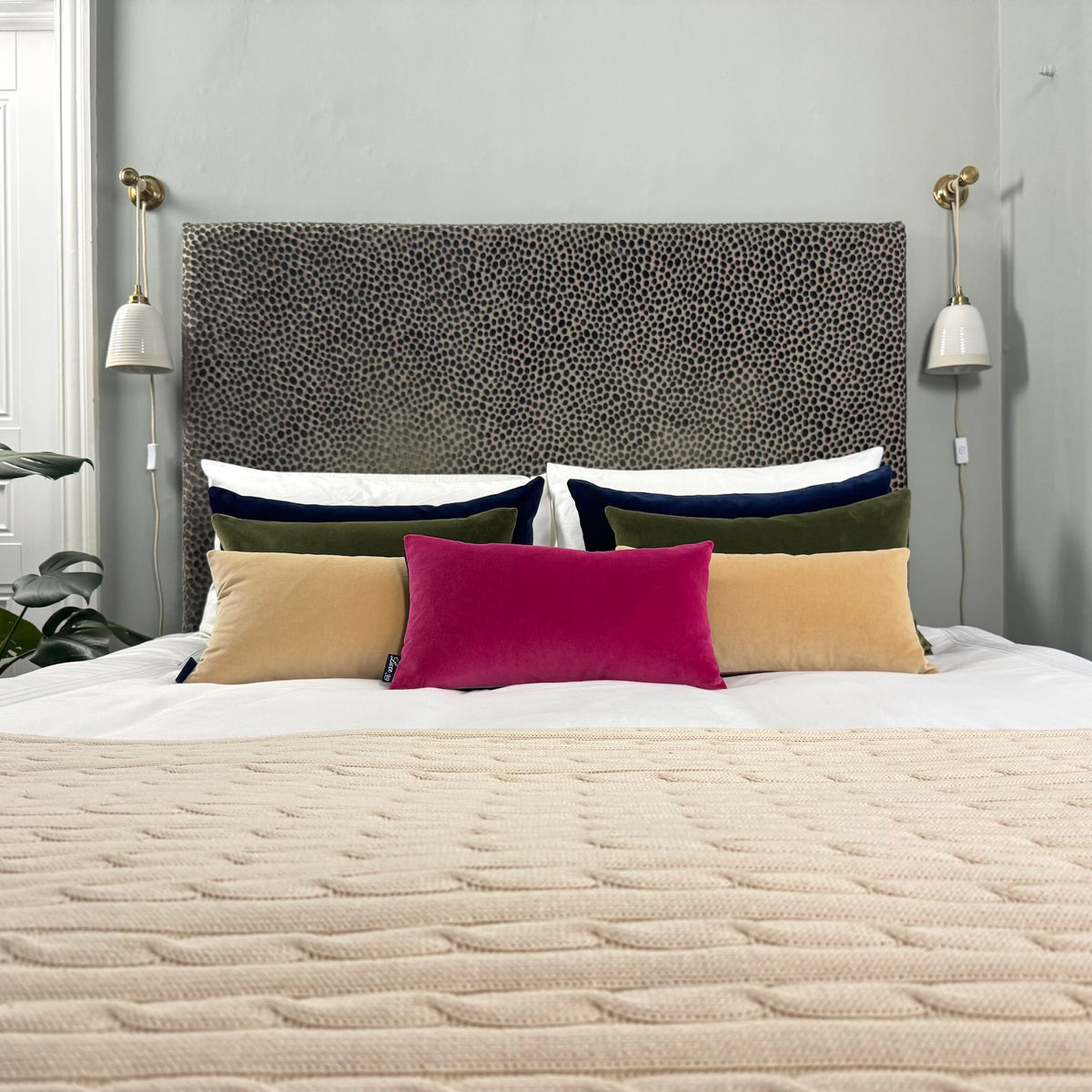 champagne velvet cushions with bright pink with animal fabric headboard