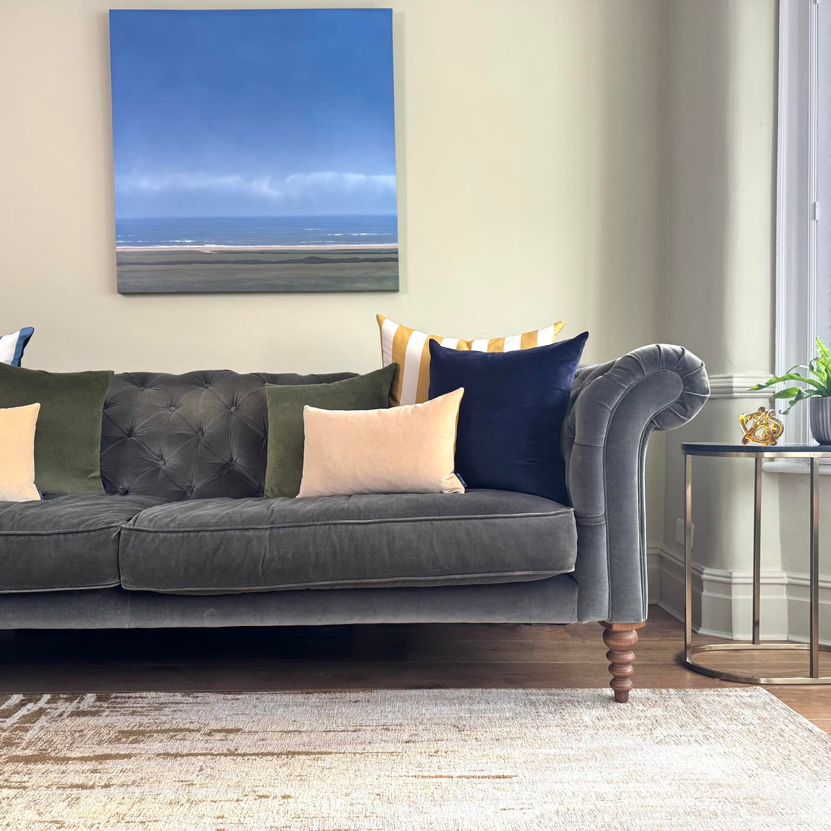 champagne velvet cushion on grey sofa