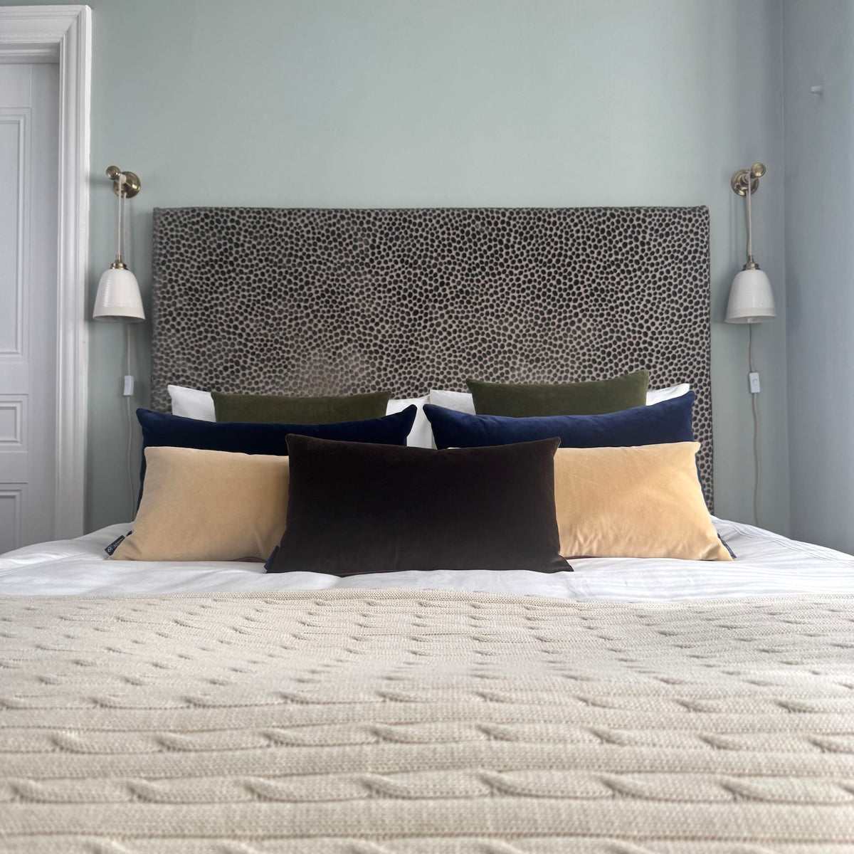 dark chocolate velvet cushions in blue room with cool colour scheme