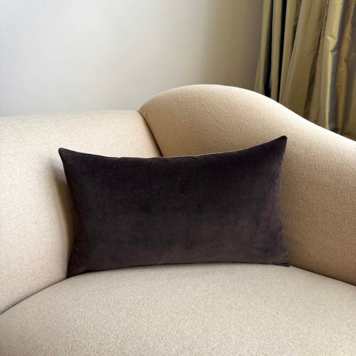 dark chocolate velvet cushion rectangle on beige sofa