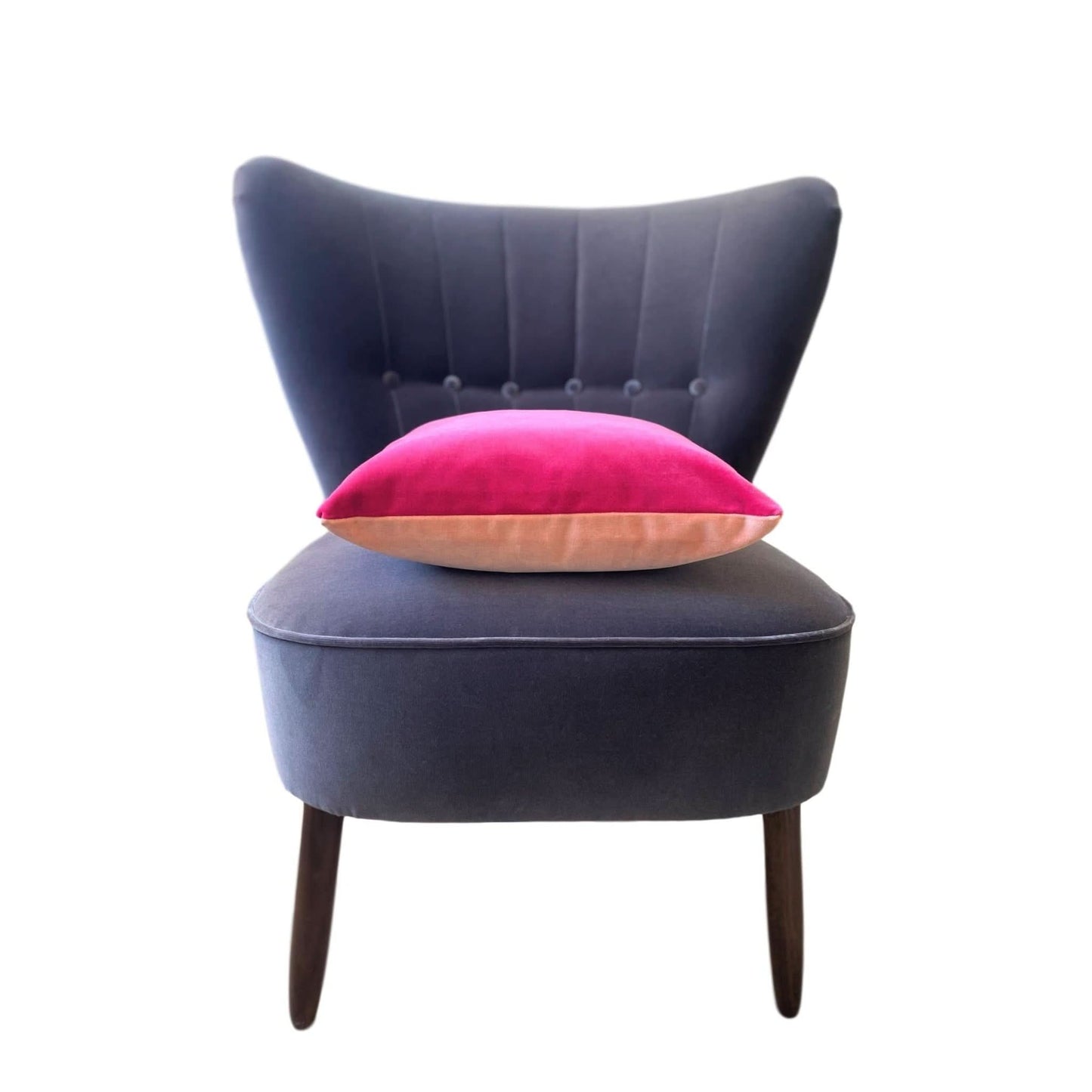 blush pink and bright pink velvet on a grey velvet chair