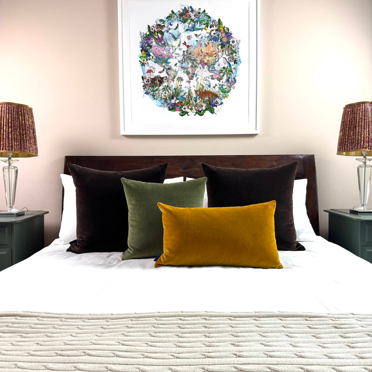 gold ochre velvet cushion with olive green and dark chocolate on white bedding