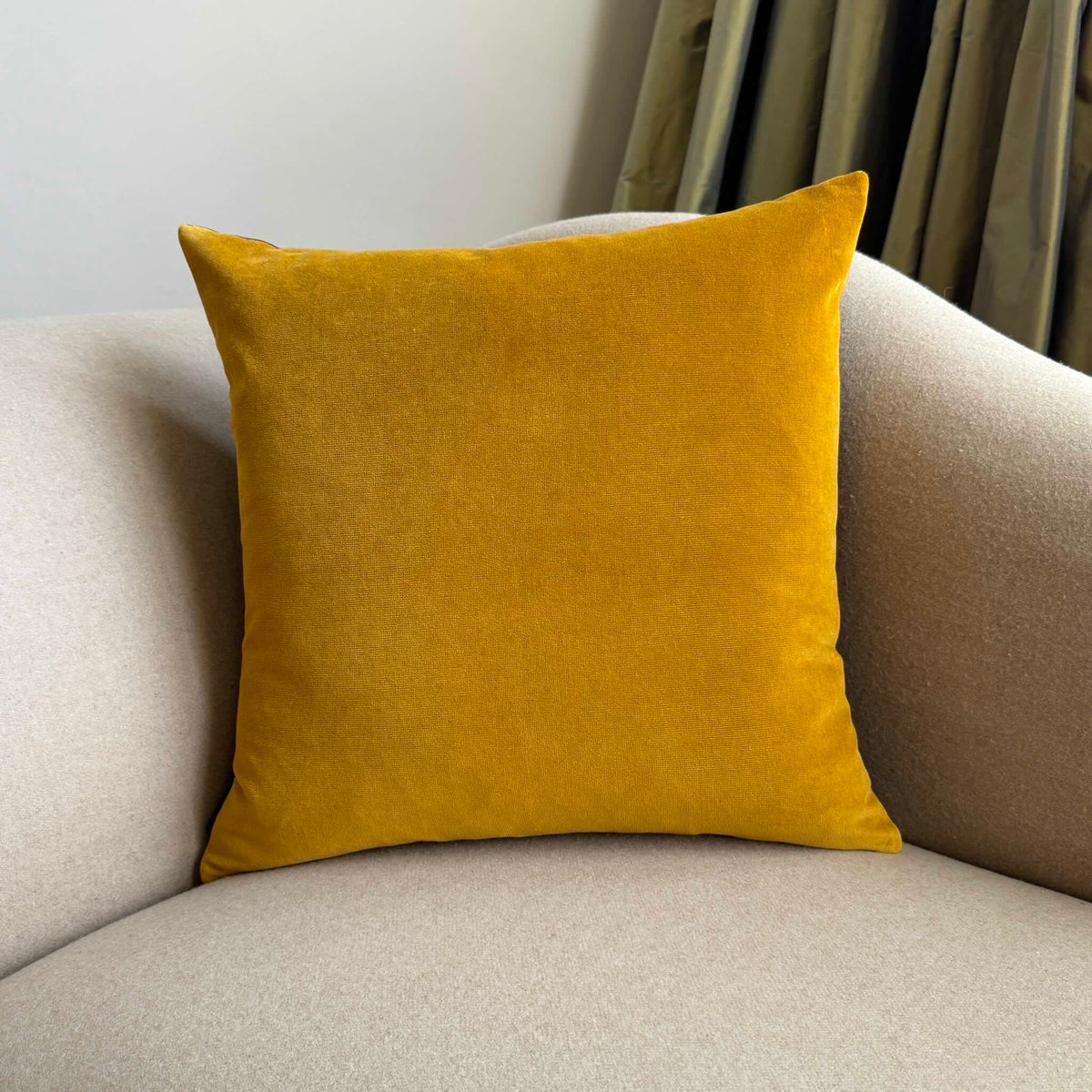 gold ochre velvet cushion square on beige sofa