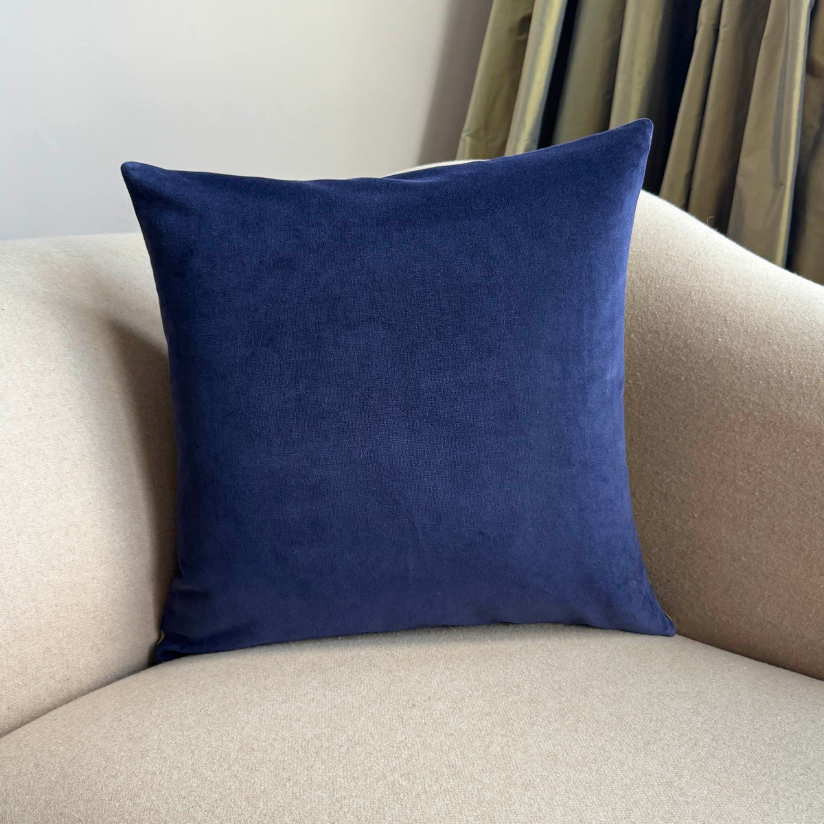 navy velvet cushion by luxe 39 on beige sofa