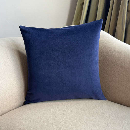 navy velvet cushion by luxe 39 on beige sofa