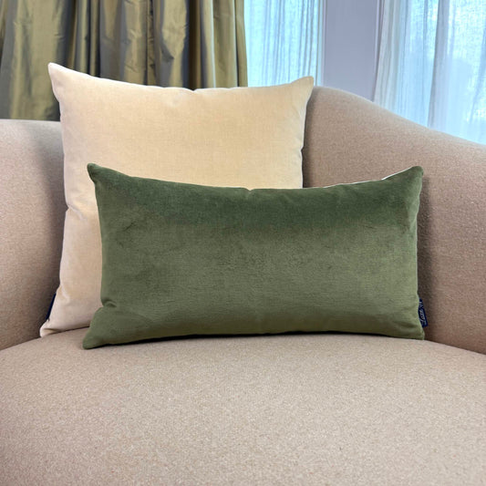 olive green and champagne reversible velvet cushion on beige sofa