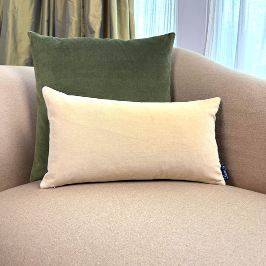 olive green and champagne velvet cushion on beige sofa