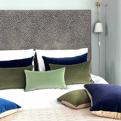 olive green velvet cushions in blue room
