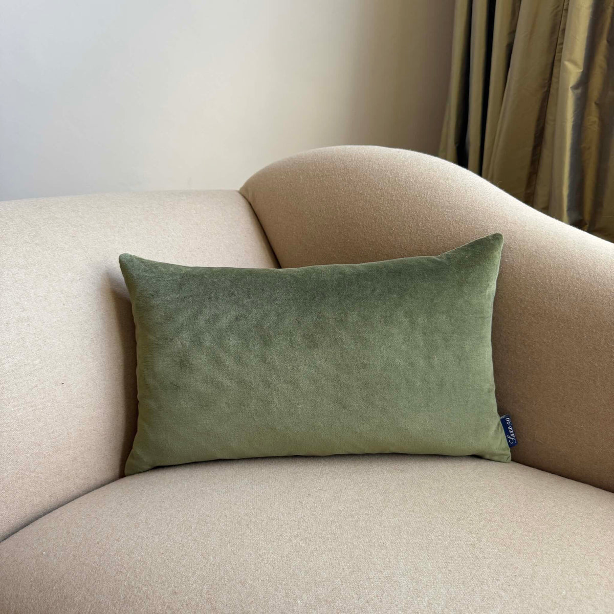 olive green velvet cushion cover rectangle on beige sofa