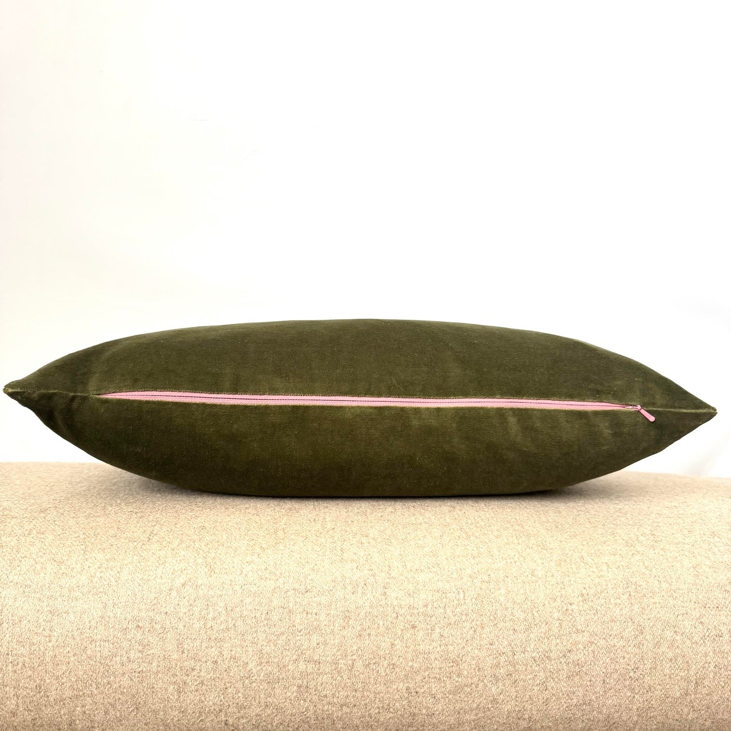 olive green velvet cushion with pink zip