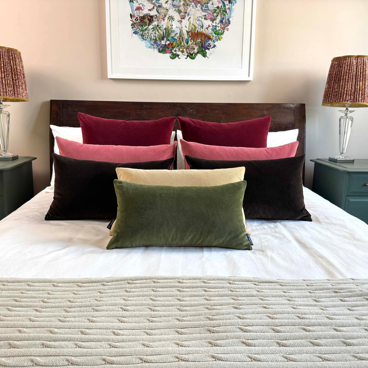 olive green velvet cushion on wooden bed