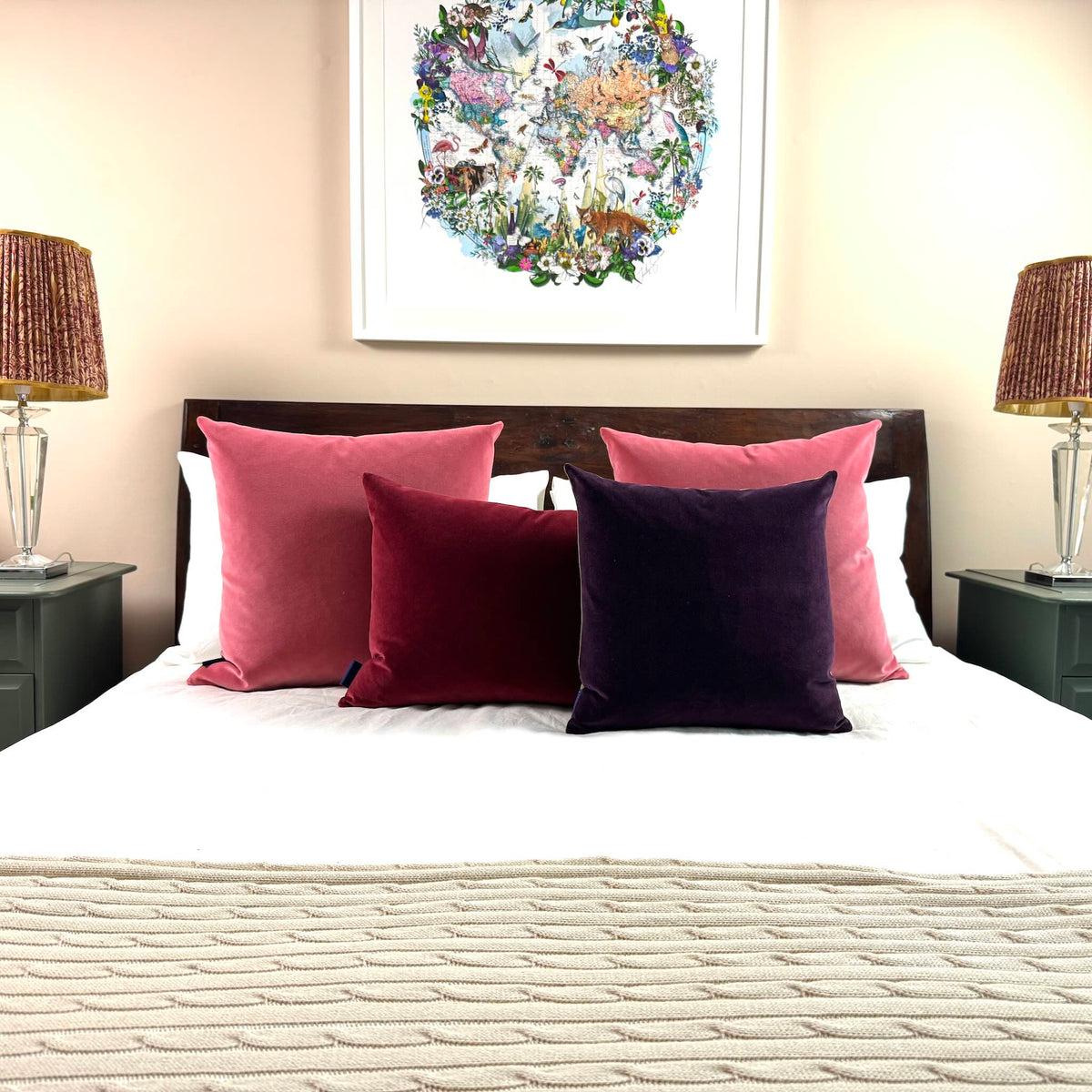 plum velvet cushion square with burgundy and rouge on wooden bed