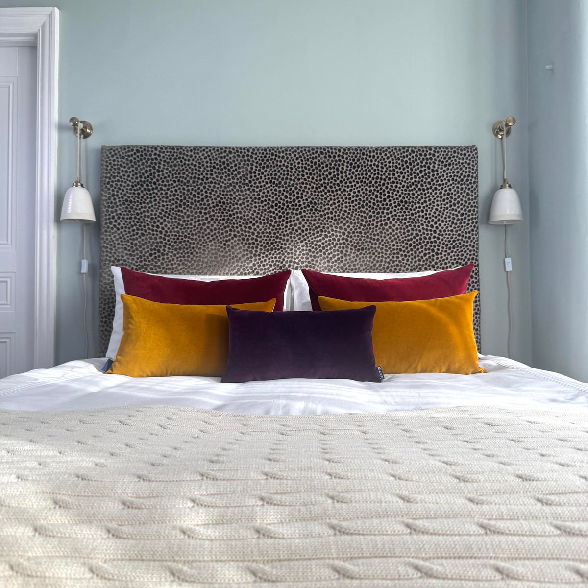 plum velvet cushion with gold ochre and burgundy