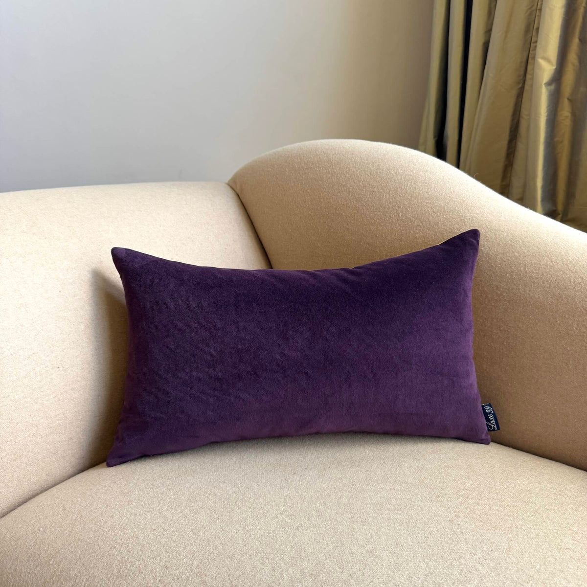 plum velvet cushion rectangle on beige sofa