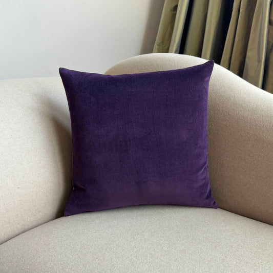 plum velvet cushion square on beige sofa