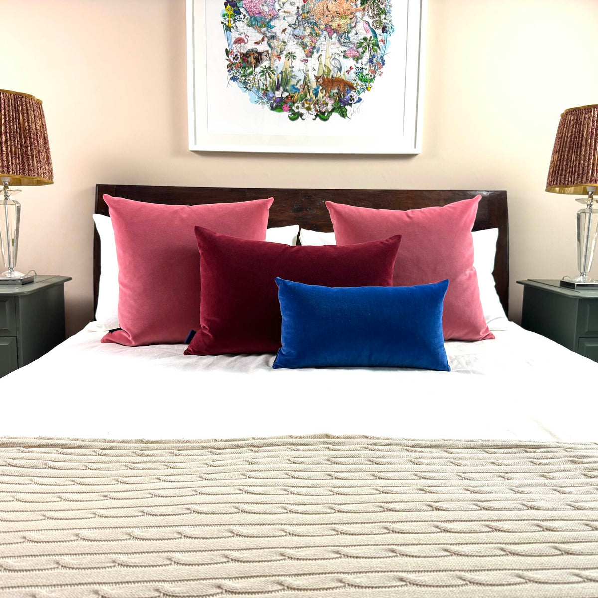 rose pink velvet cushions with burgundy and royal blue on white bedding