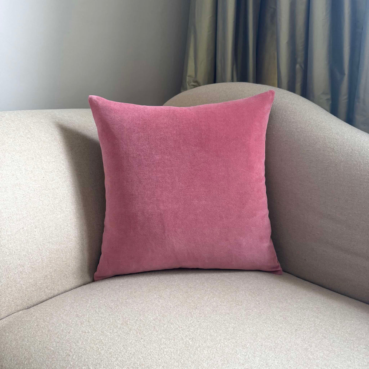 rose pink velvet cushion square on beige sofa