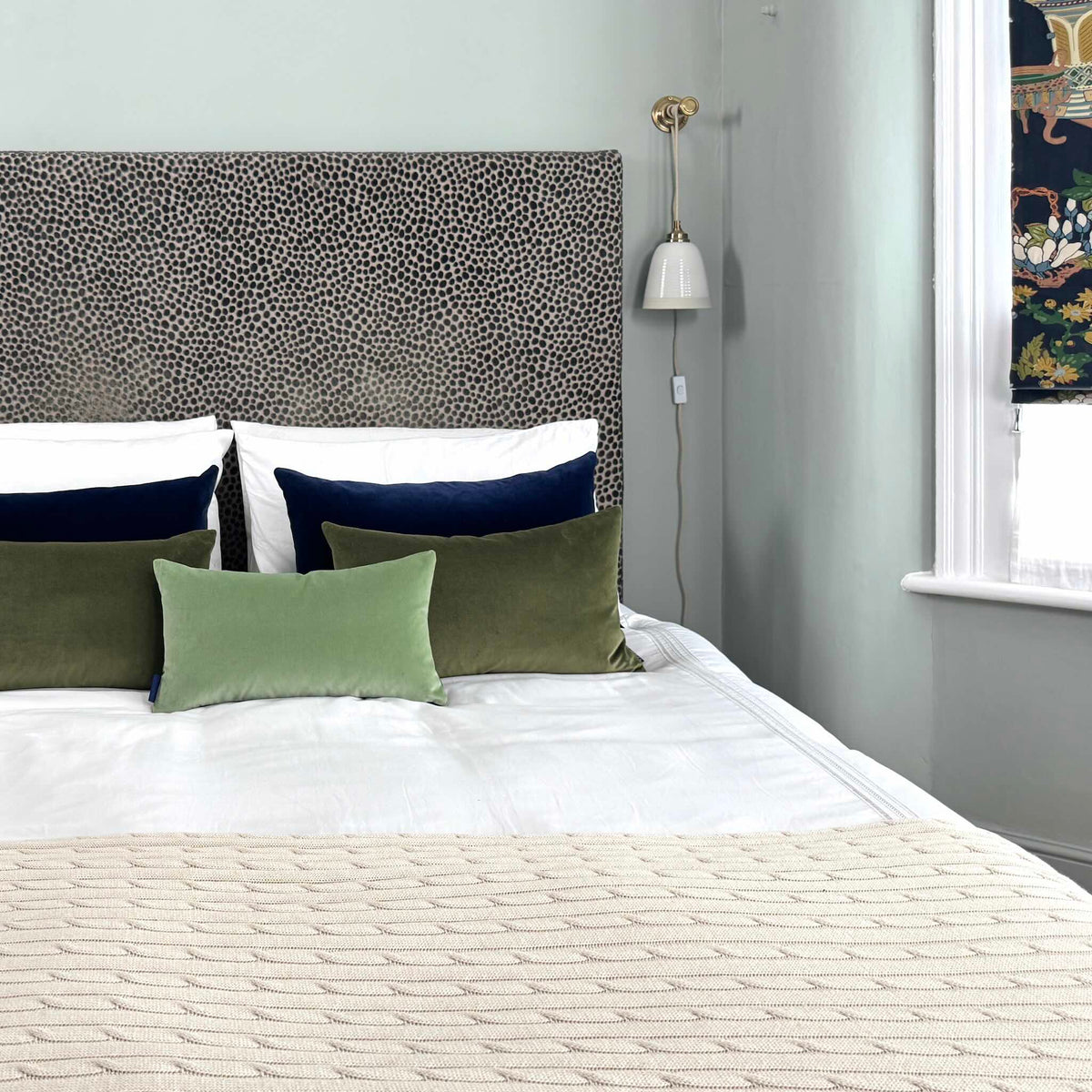 sage green velvet cushion cover in blue room