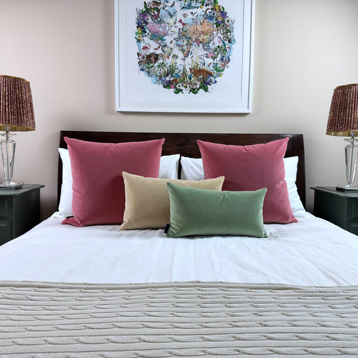 sage green velvet cushion with champagne and rouge pink on white bedding