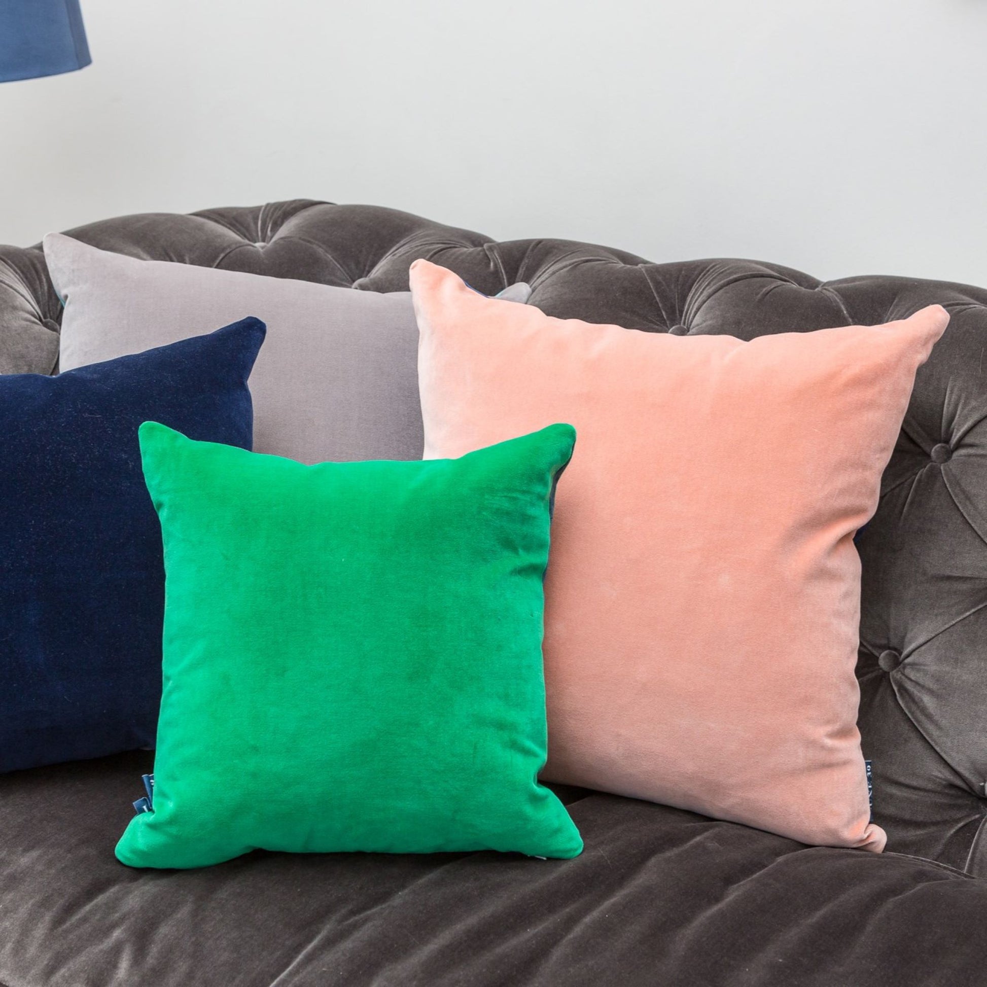 blush pink cushion with emerald, navy and silver cushions by luxe 39