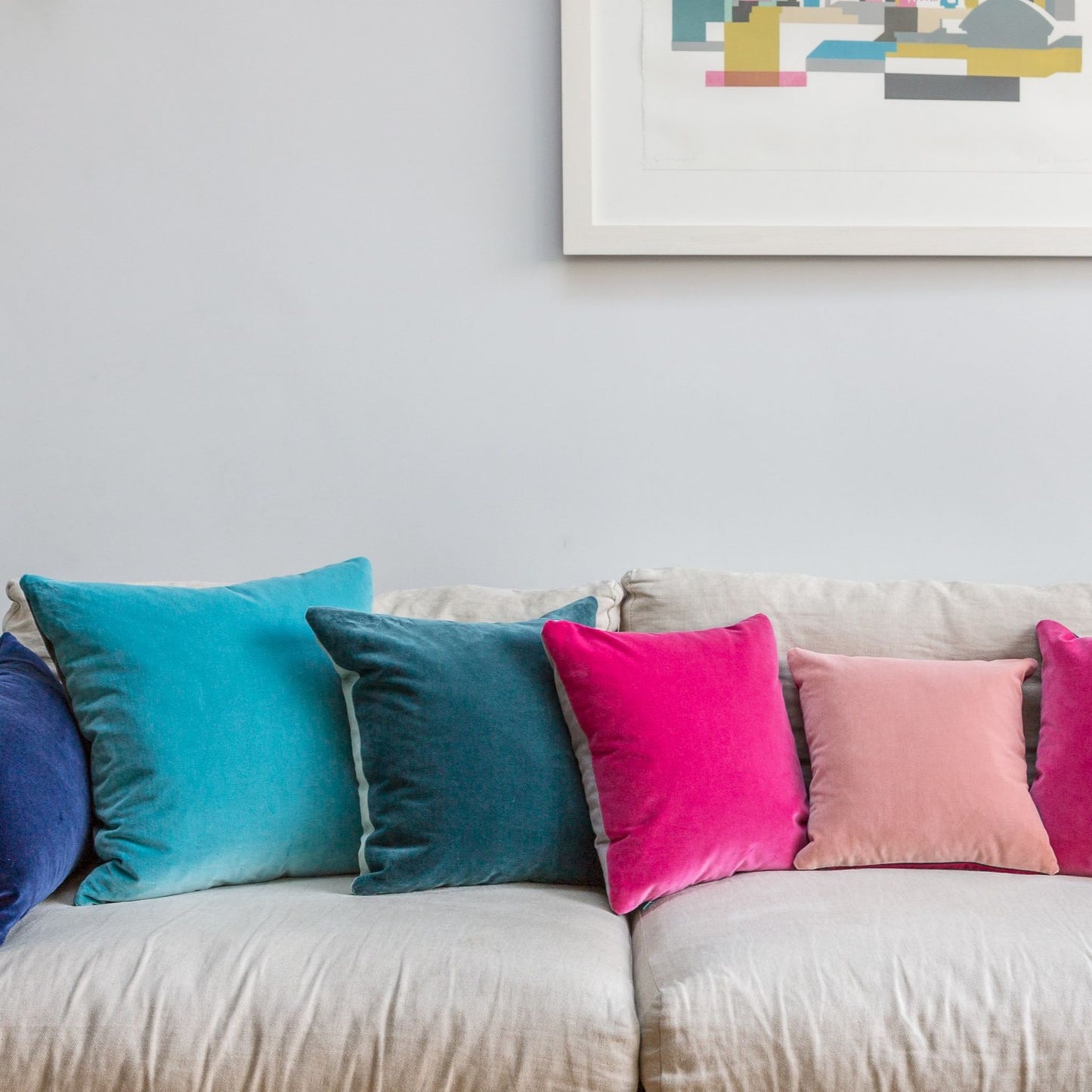 fluffy cushions on a linen sofa