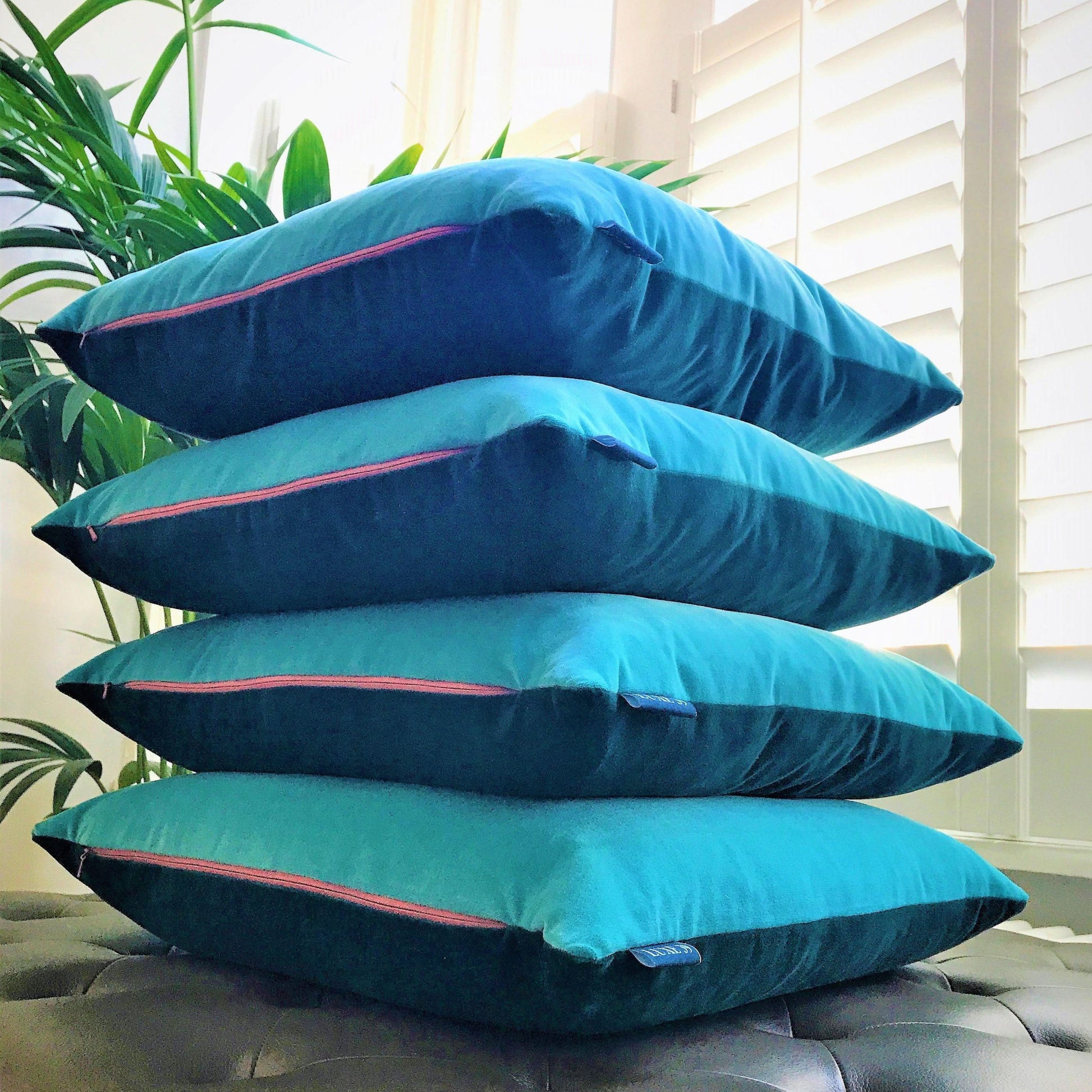 large teal cushions and covers with turquoise velvet reverse