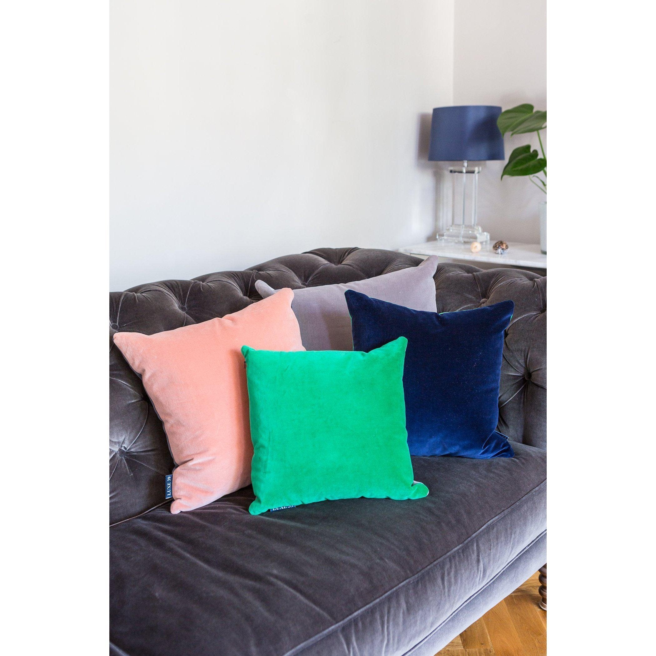 Navy blue store and pink cushions