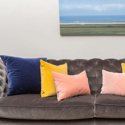 pink and yellow cushion covers