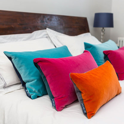 pink grey cushion with orange and turquoise cushions