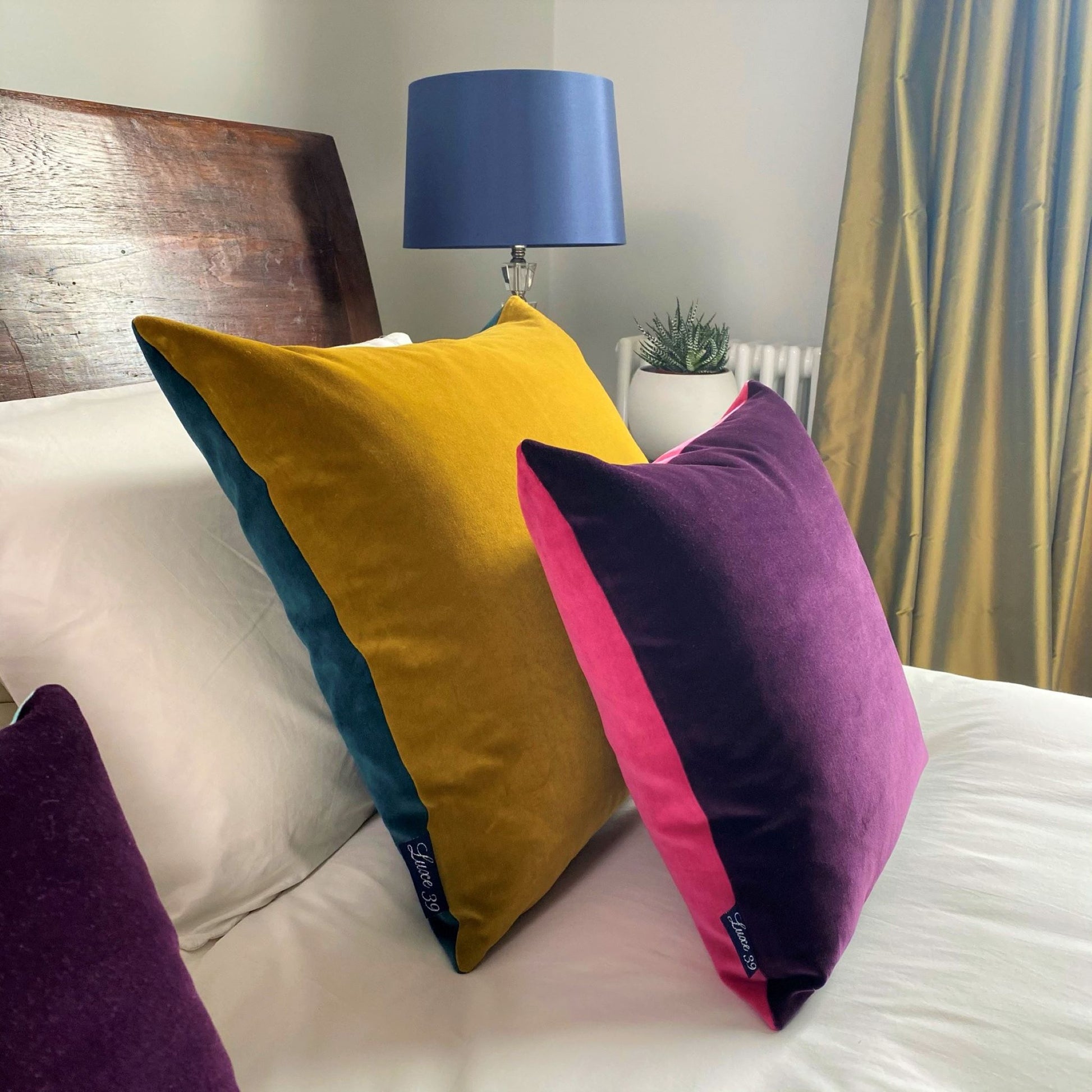 plain cushion covers in pink, purple, gold and teal