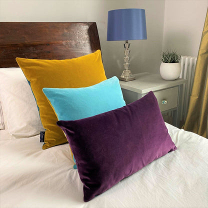 plum coloured cushion with turquoise by luxe 39