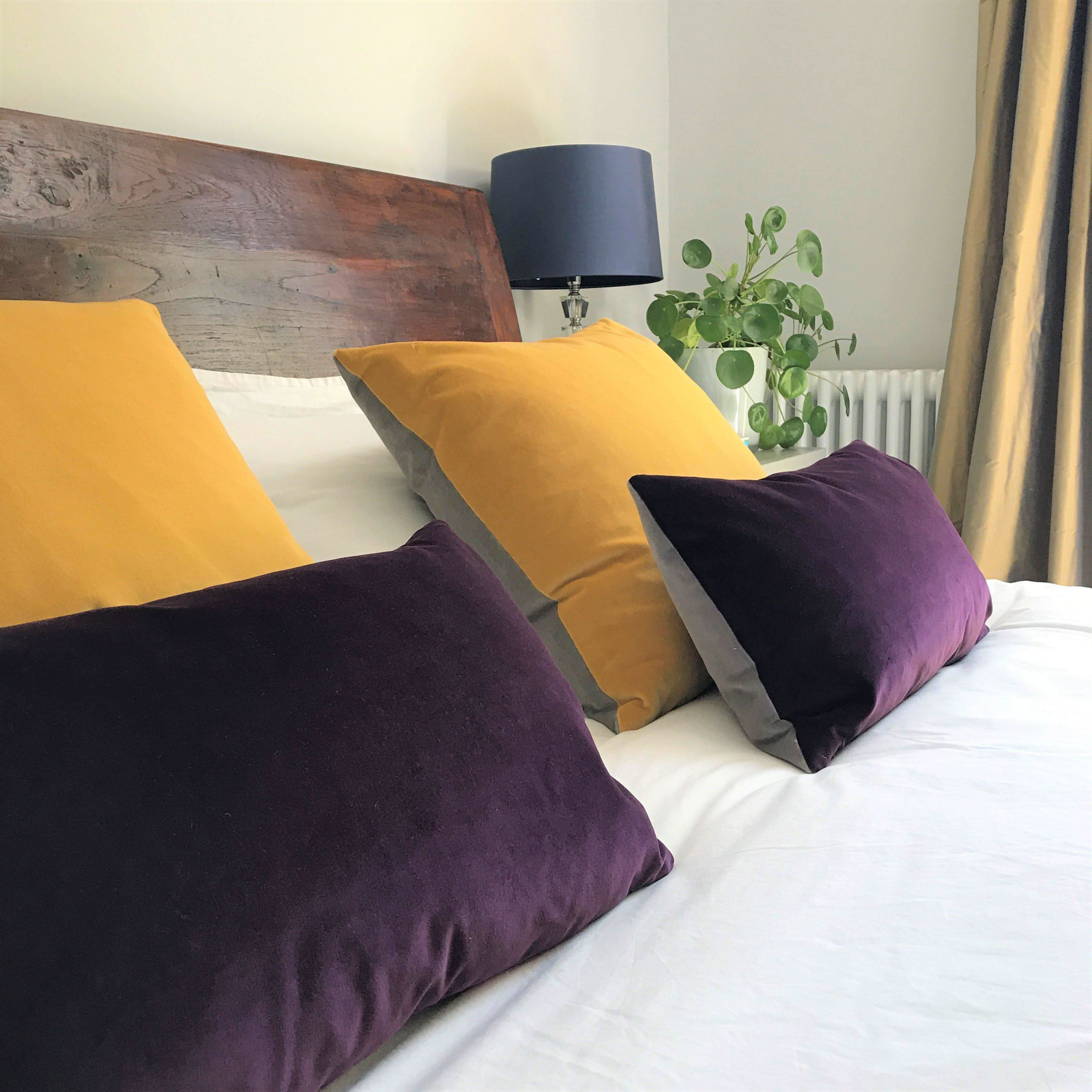 Purple and mustard sales cushions