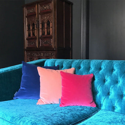 royal blue velvet cushion covers with bright pink reverse on sofa with blush pink velvet cushion