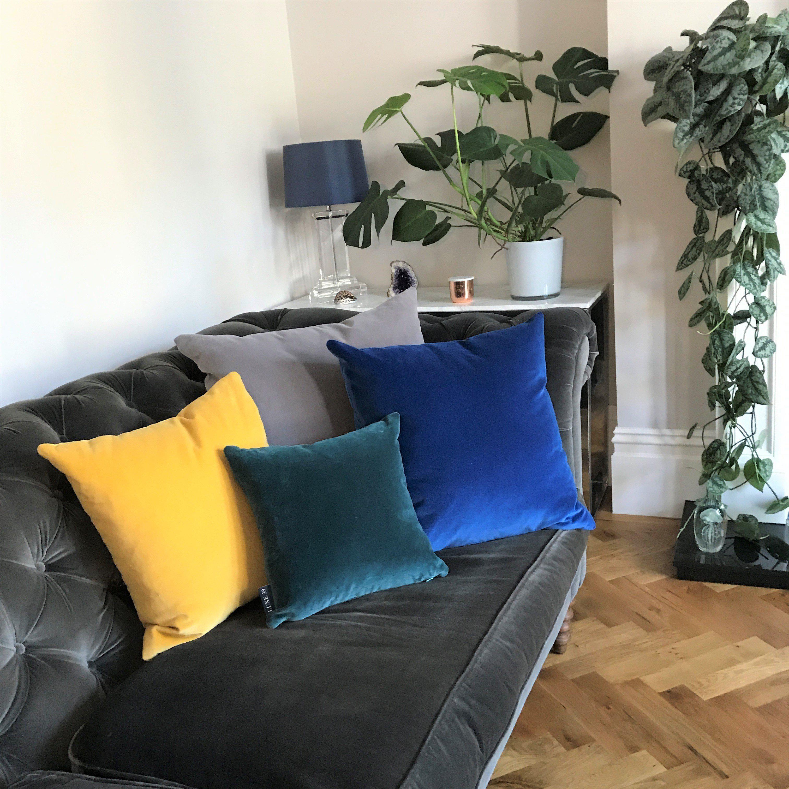 Grey sofa with navy blue deals cushions