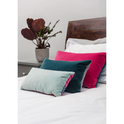 teal pillow with bright pink by Luxe 39