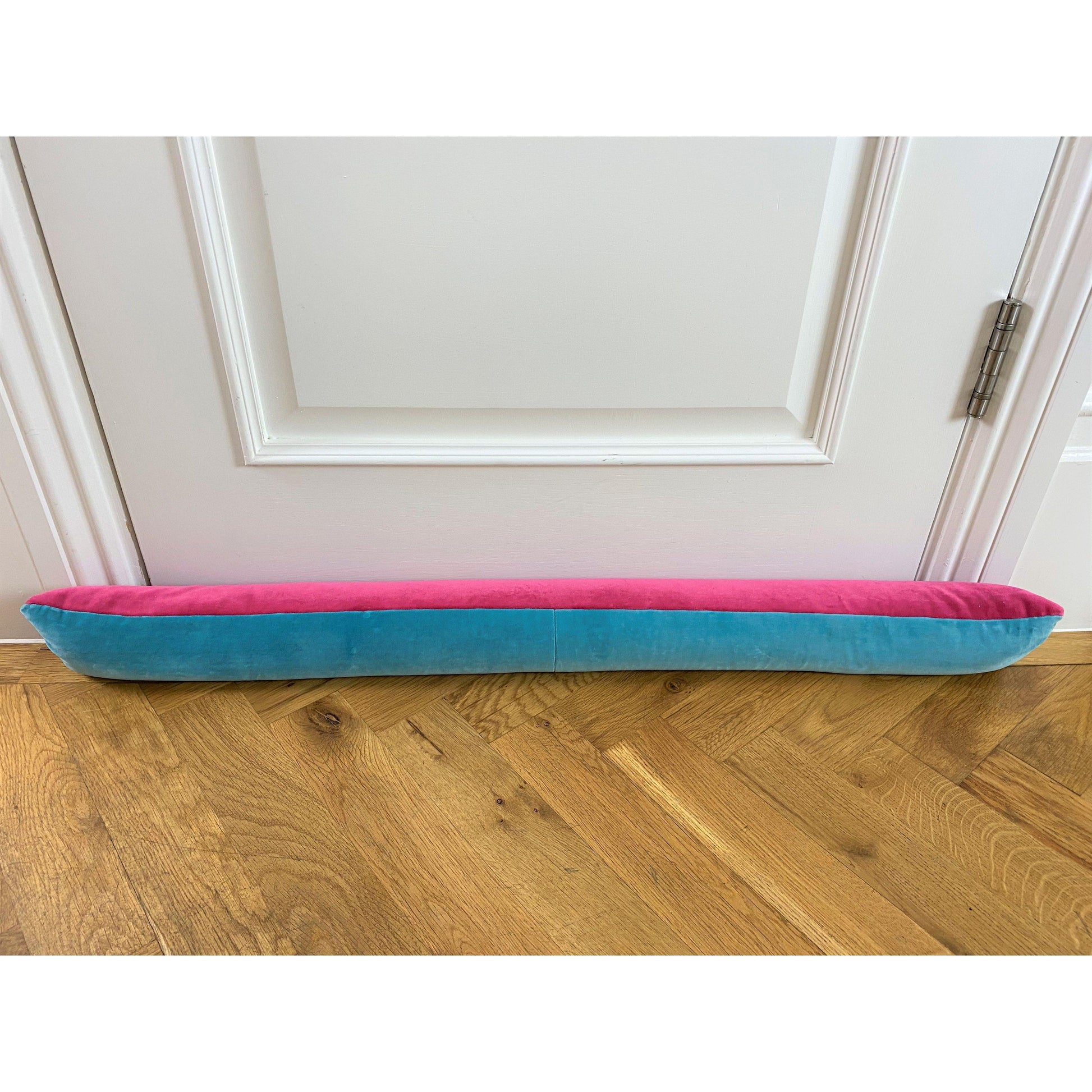 bright pink velvet draft excluder with turquoise